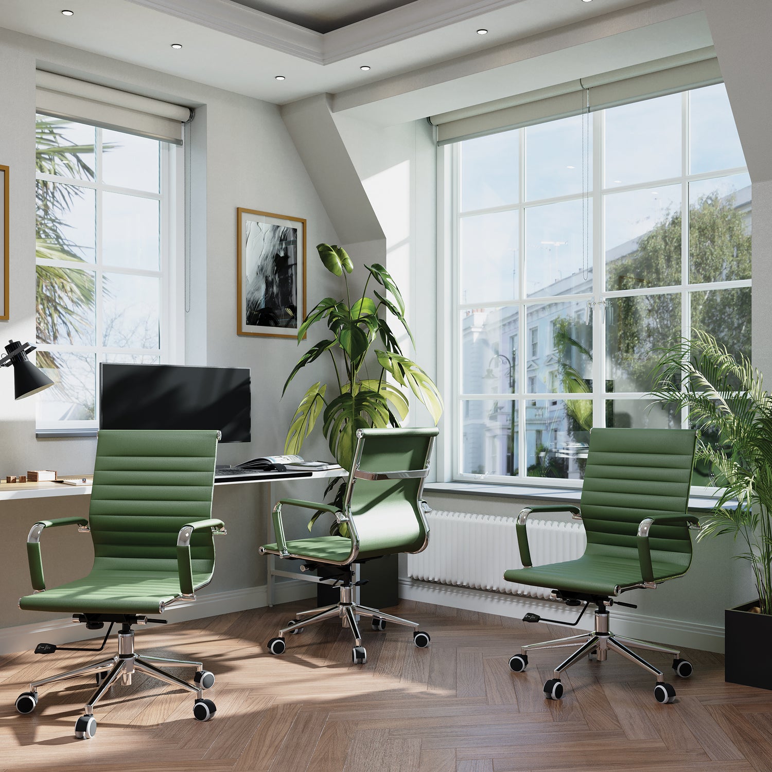 Modern office interior with green chairs, desk, and large windows.
