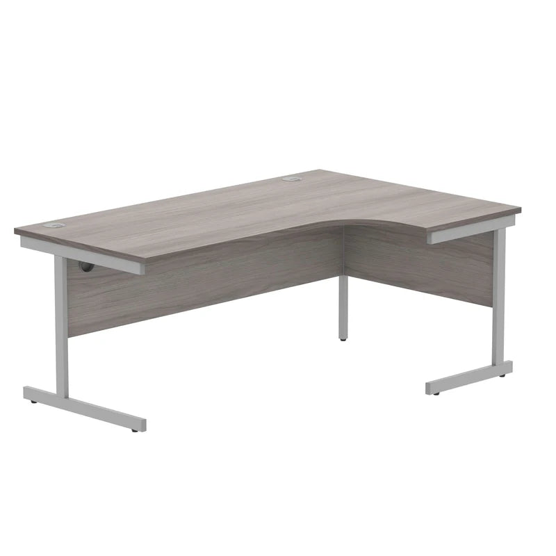 L-shaped desk with gray wooden top and silver metal legs on a white background