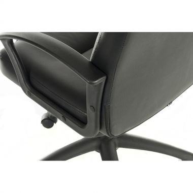 Close-up of a black office chair's armrest and seat.