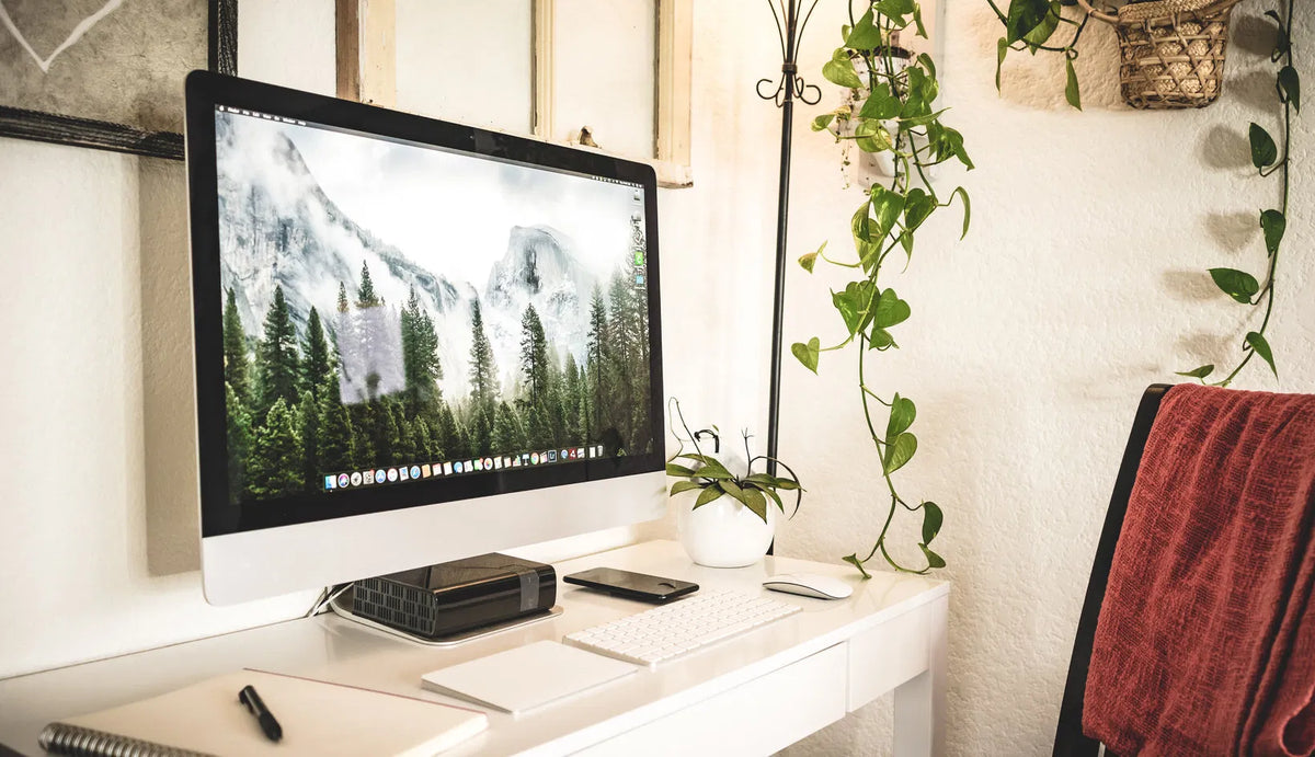 A modern home office desk setup, showing a realistic product-focused workspace suitable for hybrid working.