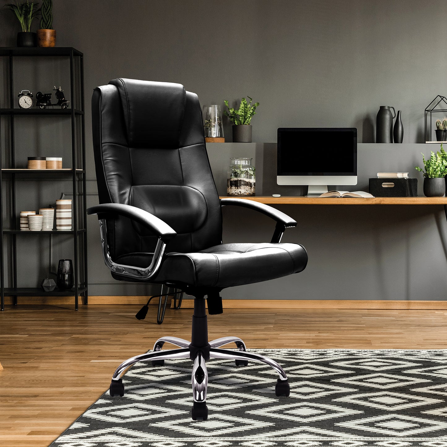 Black leather office chair in a modern home office setting with a desk and decor.