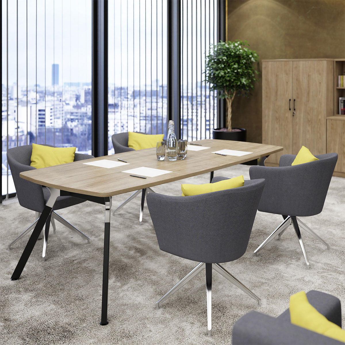 Modern office meeting room with a long wooden table and gray chairs with yellow cushions.