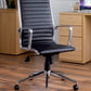 Black office chair with chrome accents in an office setting