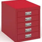 Red metal file cabinet with multiple drawers on a white background