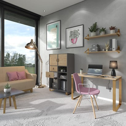 Modern living room with a desk, chair, and decor elements.