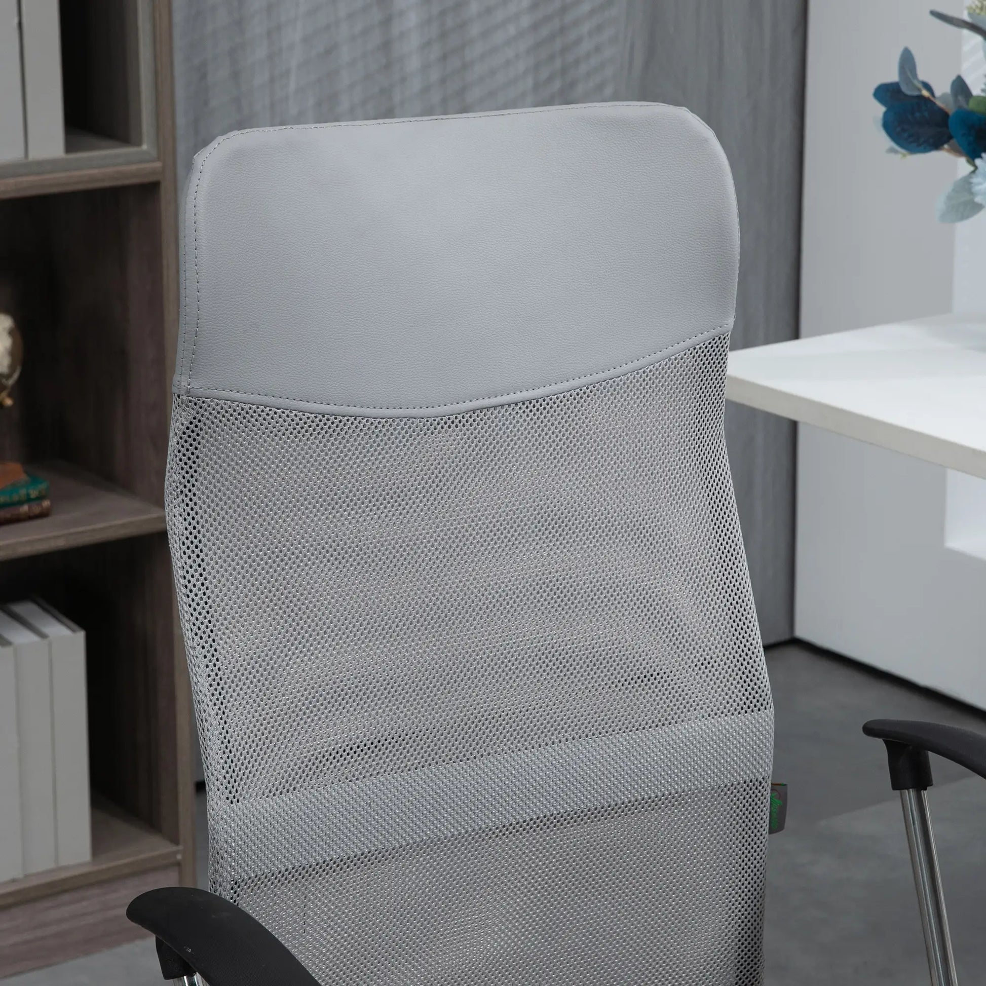 Gray office chair with mesh back in an office setting