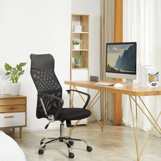 Modern office setup with a black mesh office chair, wooden desk, and computer monitor.