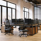 Modern office with desks, chairs, and large windows overlooking a cityscape.