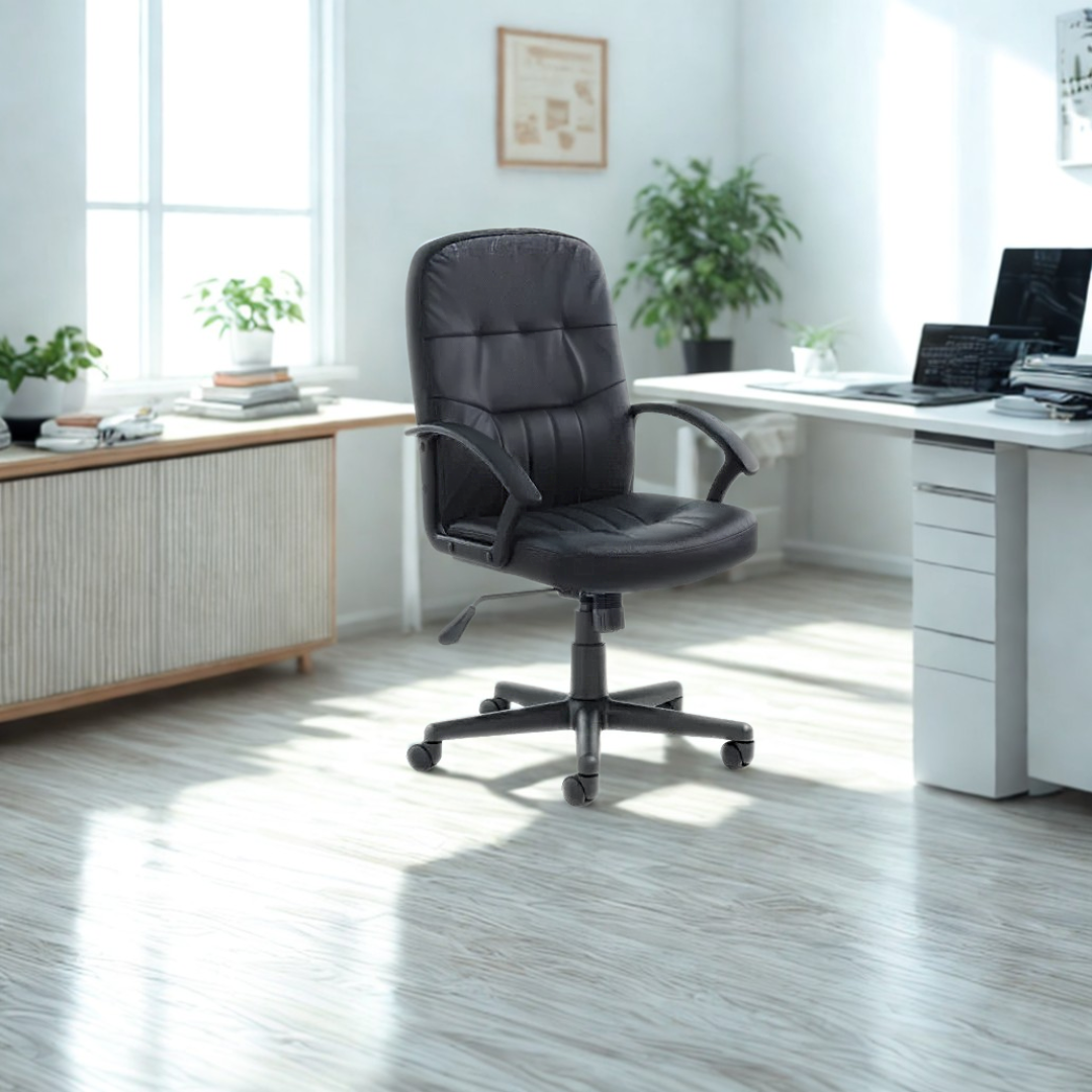 Black office chair in a bright office setting with a desk and plants.