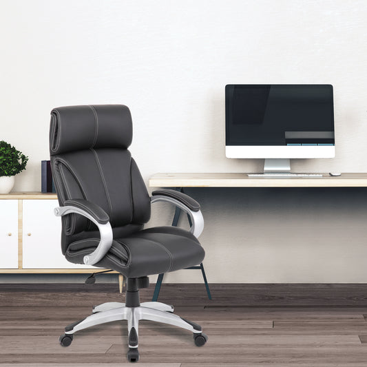 Black office chair in a modern office setting with a computer monitor.