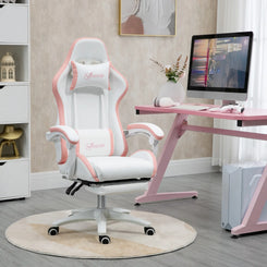 A white and pink faux leather gaming chair with footrest, positioned in a room with a pink desk and a computer setup.