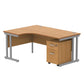 Wooden L-shaped desk with metal legs on a white background