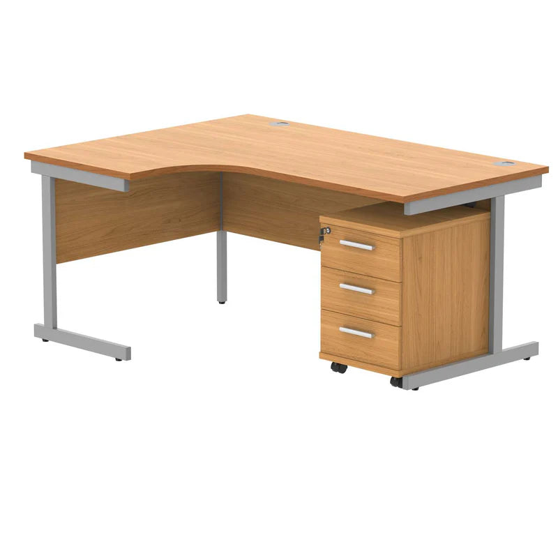 Wooden L-shaped desk with a silver metal frame on a white background