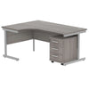 Corner office desk with grey finish and silver metal legs on a white background