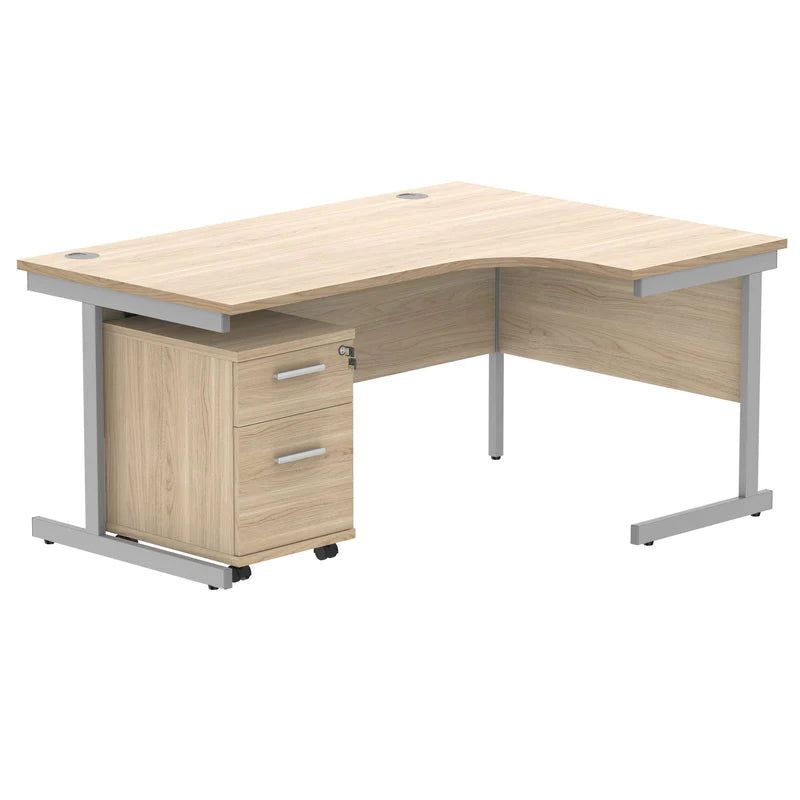 Wooden L-shaped desk with silver legs on a white background