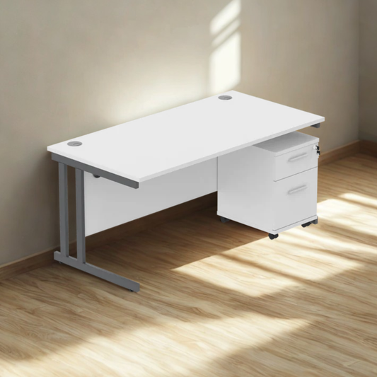 White office desk with a cabinet on a wooden floor with sunlight casting shadows.