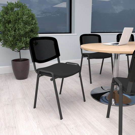 Meeting chairs arranged around a table in a bright, modern room