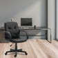 Modern office setup with black office chair and desk against a gray wall.