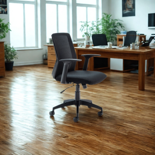Black office chair in a modern office setting with wooden desks and plants.