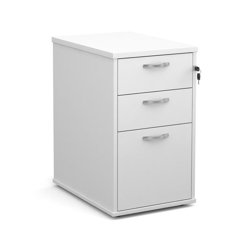 A wooden mobile pedestal with three drawers, lockable with silver handles, in an office setting.