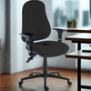 Black office chair in an office setting with a desk and windows in the background.