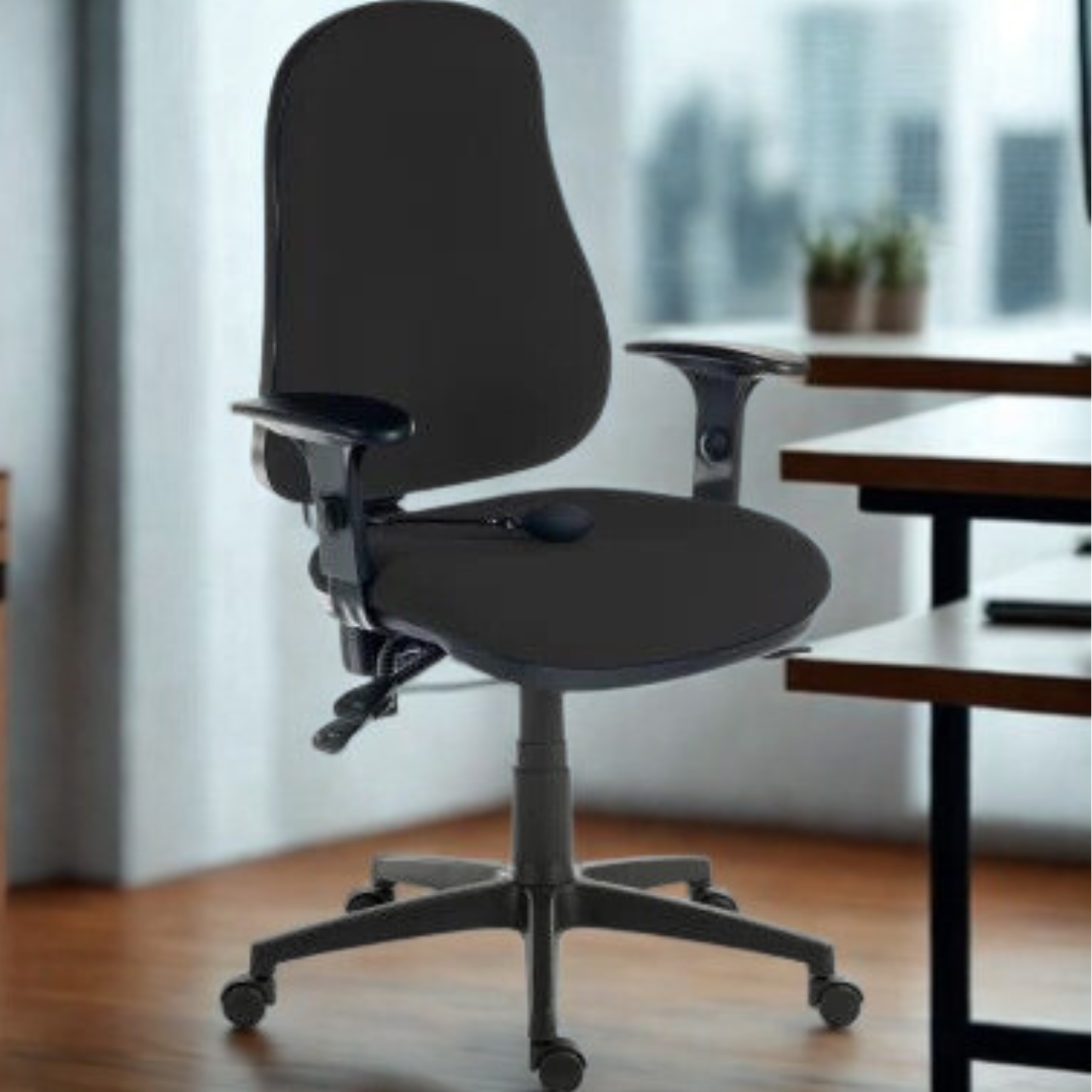 Black office chair in an office setting with a desk and windows in the background.