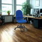 Blue office chair in a modern office setting with wooden floor and desk.
