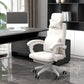 Cream office chair in a modern office setting with a desk and computer.