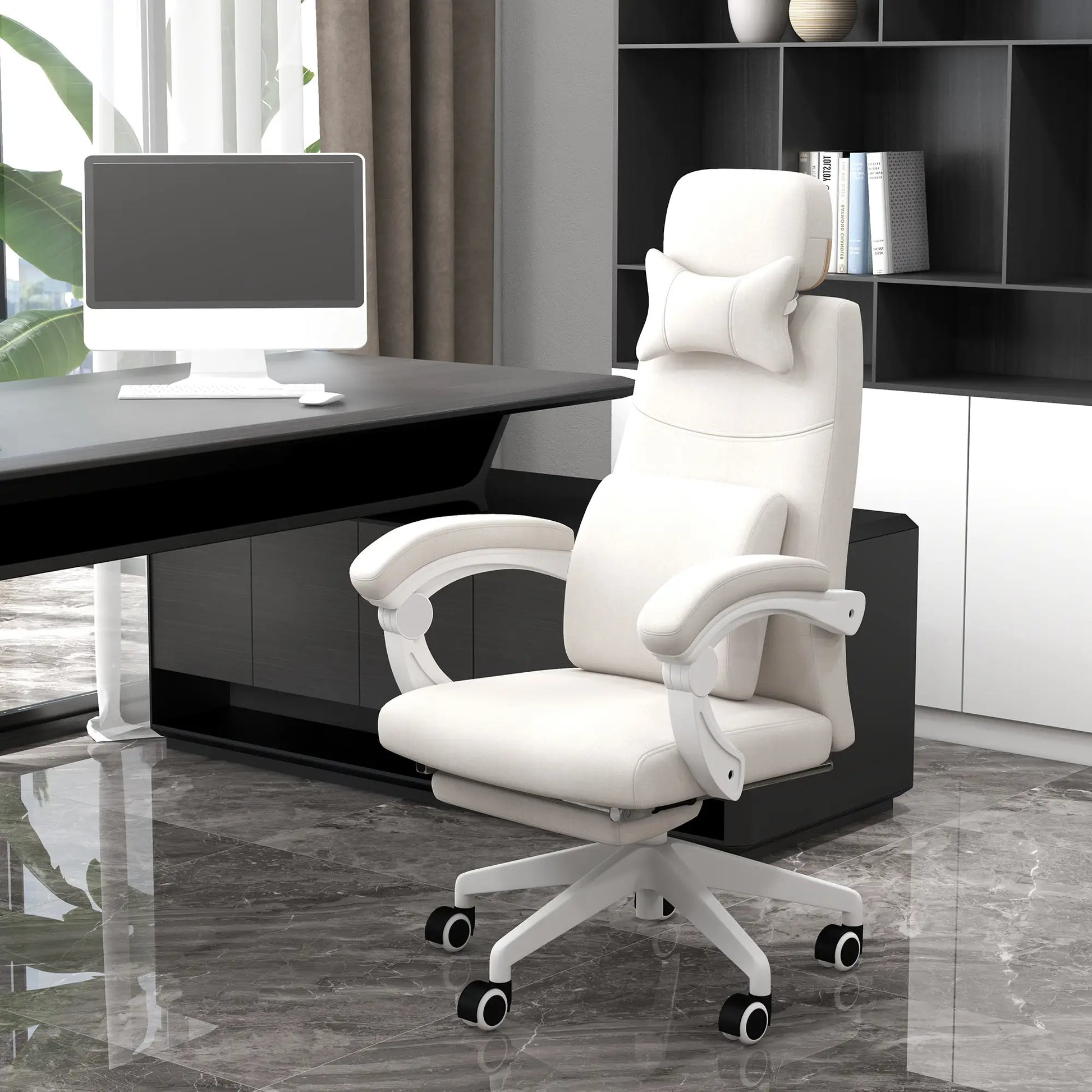 Cream office chair in a modern office setting with a desk and computer.