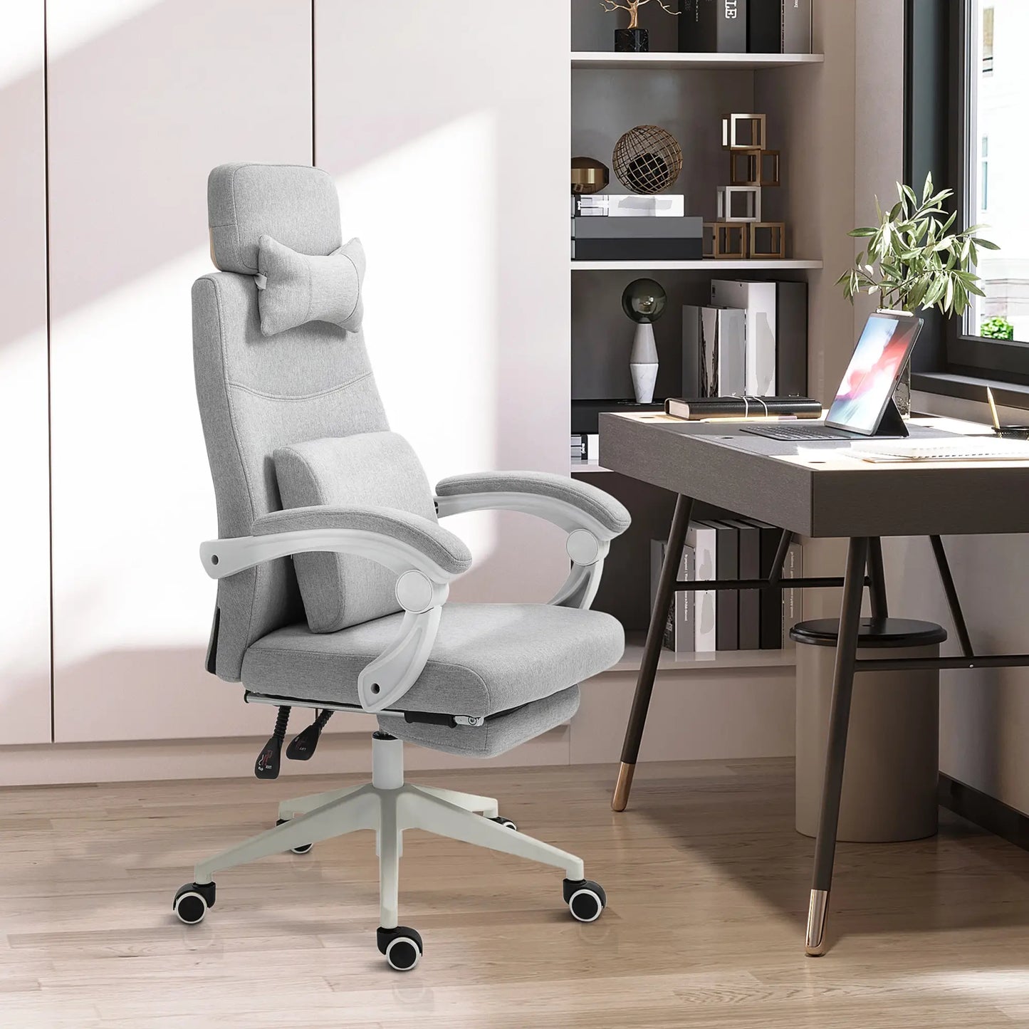 Gray office chair in a modern office setting with a desk and decor.