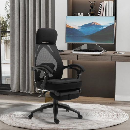 Black office chair in front of a computer desk with a monitor displaying a mountain scene.