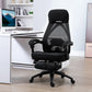 Black office chair in a modern office setting with a computer desk.