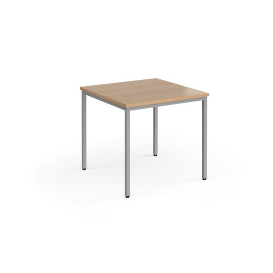 A rectangular conference room table with a wood-like tabletop and a gray steel frame.