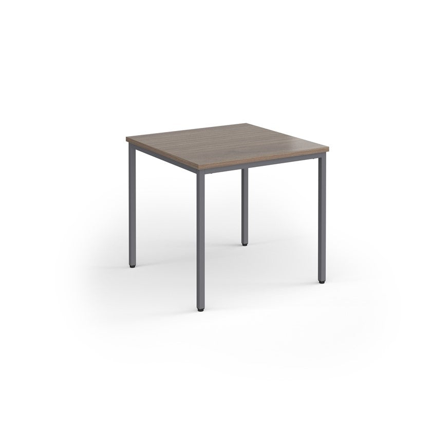 A rectangular conference room table with a wood-like tabletop and a gray steel frame.