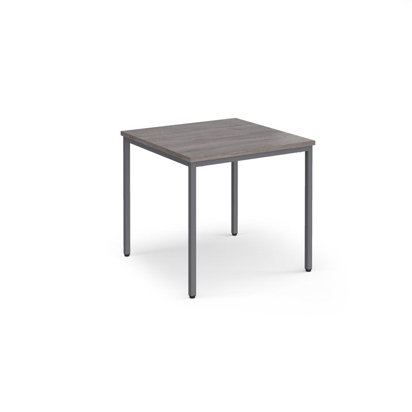 A rectangular conference room table with a wood-like tabletop and a gray steel frame.