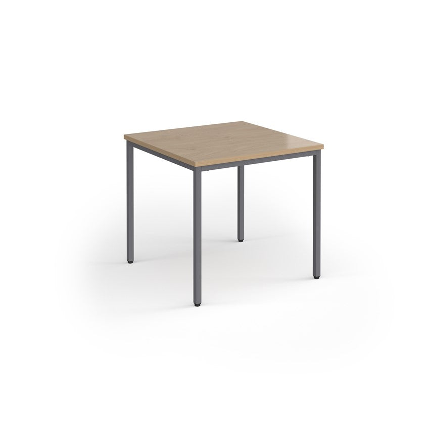 A rectangular conference room table with a wood-like tabletop and a gray steel frame.