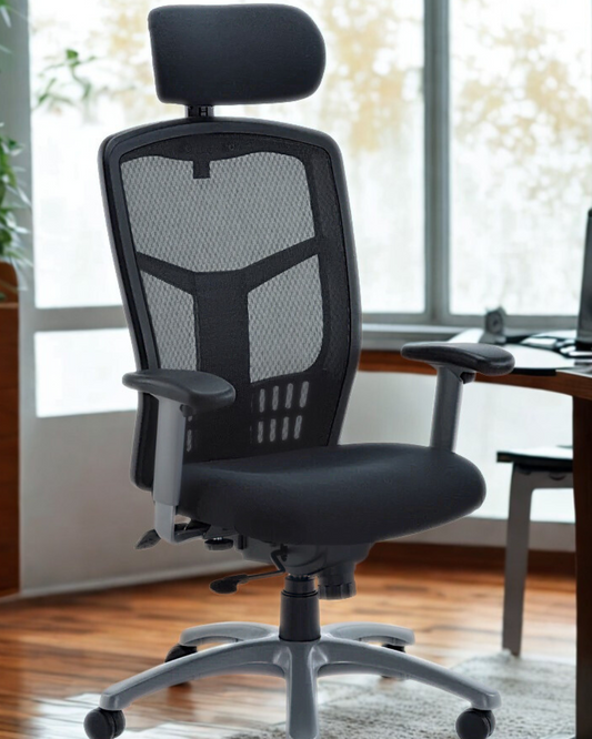 Black office chair with mesh back in a room with large windows.