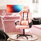 A pink gaming chair with lumbar and headrest support, placed in a room with a computer setup, featuring a large swivel seat and a high backrest.