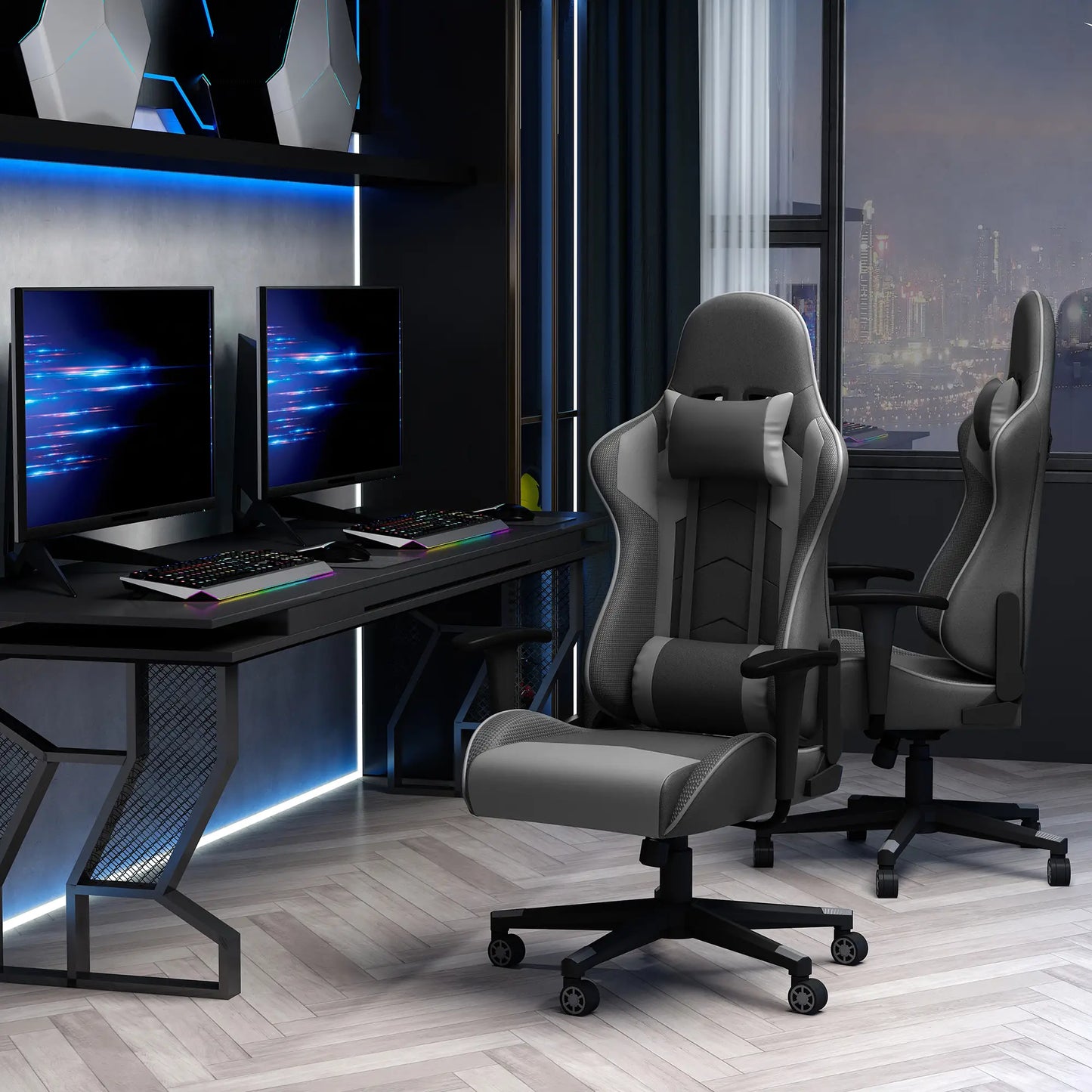 A black and gray gaming chair with a racing design, equipped with head pillow and lumbar support, positioned in a room with a computer setup.