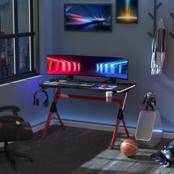 Gaming Desk with RGB LED Lights, Racing Style Computer Table, Red in a bedroom setting