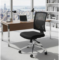 Modern office desk with a chair and laptop in a bright room with large windows.