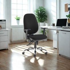 Black office chair in a bright office setting with white furniture and plants.