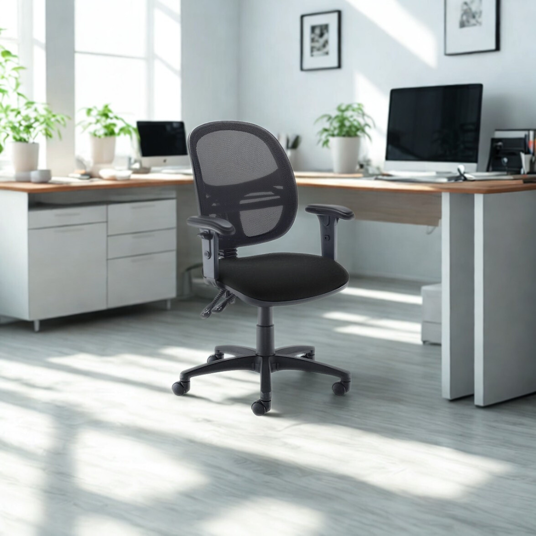 Modern office setup with a black office chair in front of a desk.