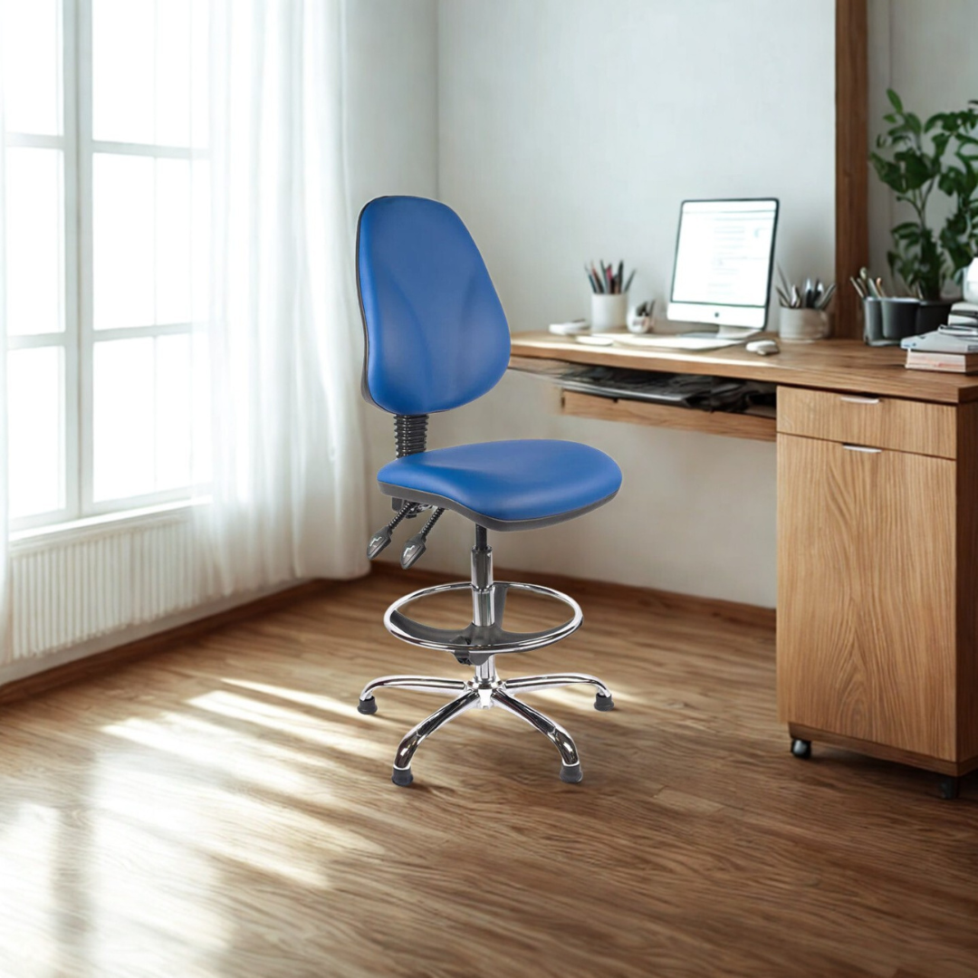 Blue office chair in front of a wooden desk with a computer setup in a bright room.
