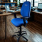 Blue office chair with 'Chilli' branding in an office setting