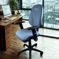 Blue office chair with 'Chilli' branding in an office setting