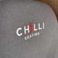Blue chair with 'Chilli Seating' logo on a wooden floor background