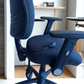 Blue office chair with adjustable features in an office setting