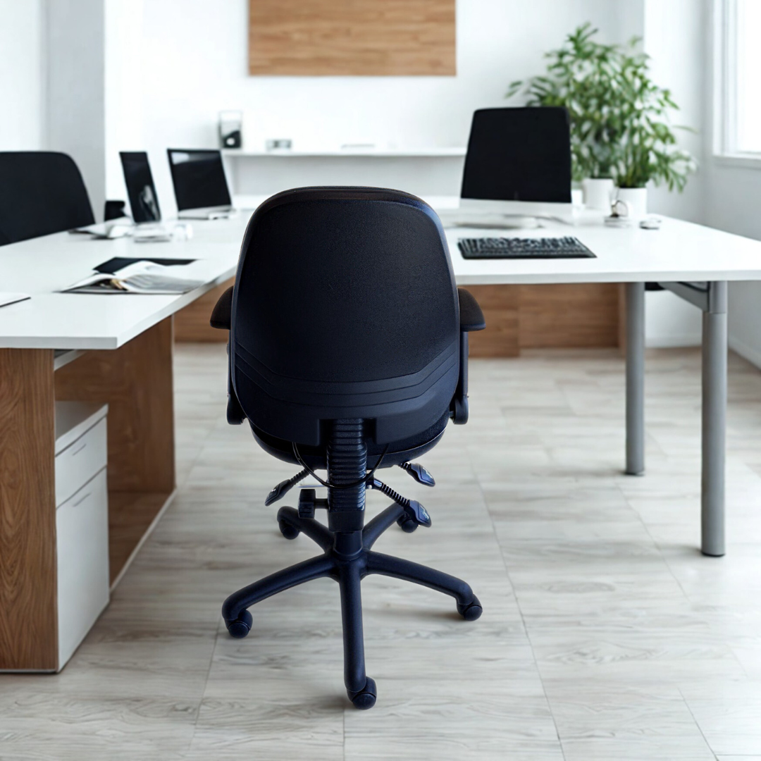 Modern office setup with a black office chair in the foreground