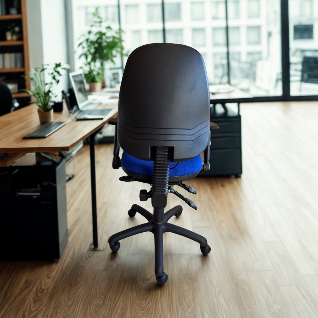 Office chair in an office setting with a desk and large windows.